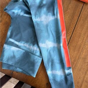 Nike Dri Fit women’s Blue Tie-Dye Leggings with orange Stripe